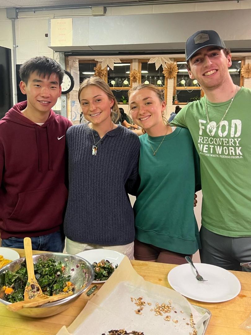 Four students smile for the camera