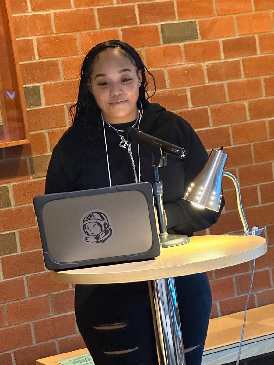 Student Zaria Williams reads an original poem