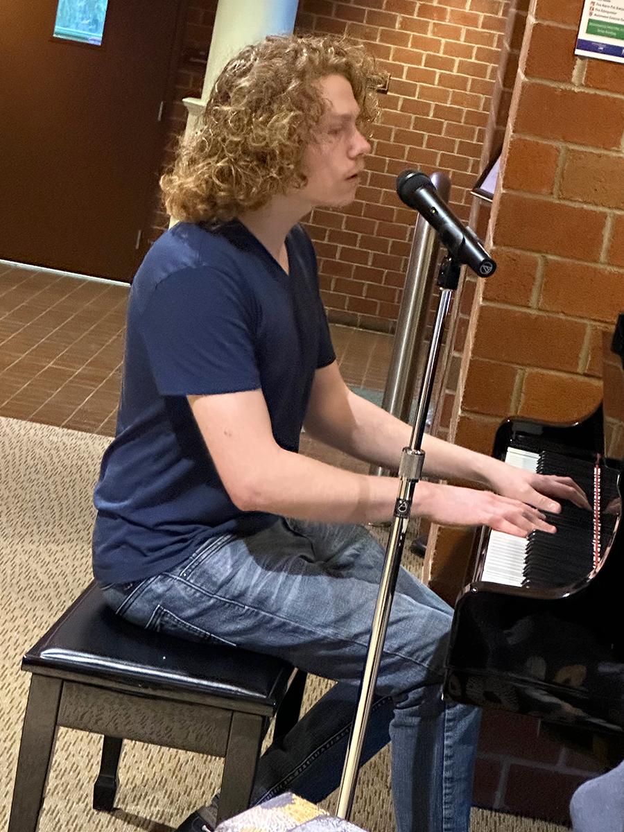 Levi Custer performs a song.