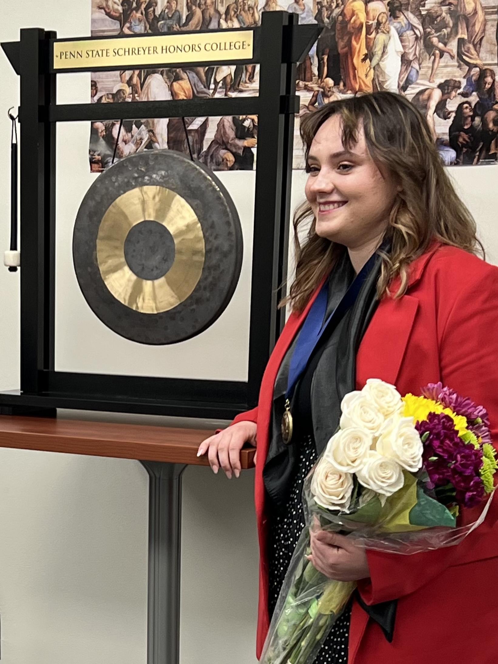 Viktoriia Vozharenko, a Scholar at Penn State Berks rings the gong