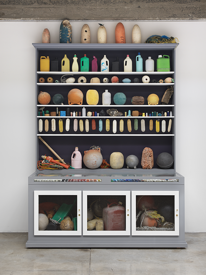 Sculpture of marine debris on a large cabinet