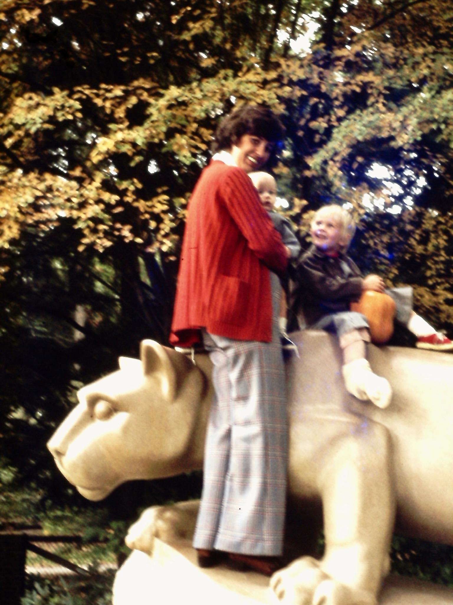 Woman with two children at the Nittany Lion Shrine at Penn State. 