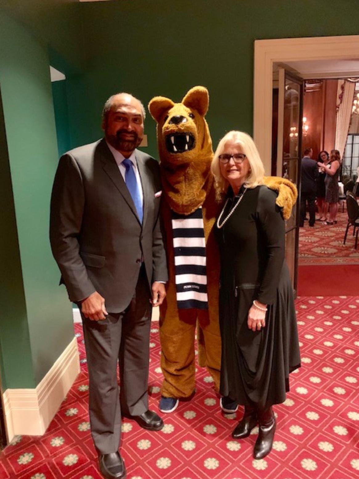 Franco and Dana Harris standing with the Nittany Lion.