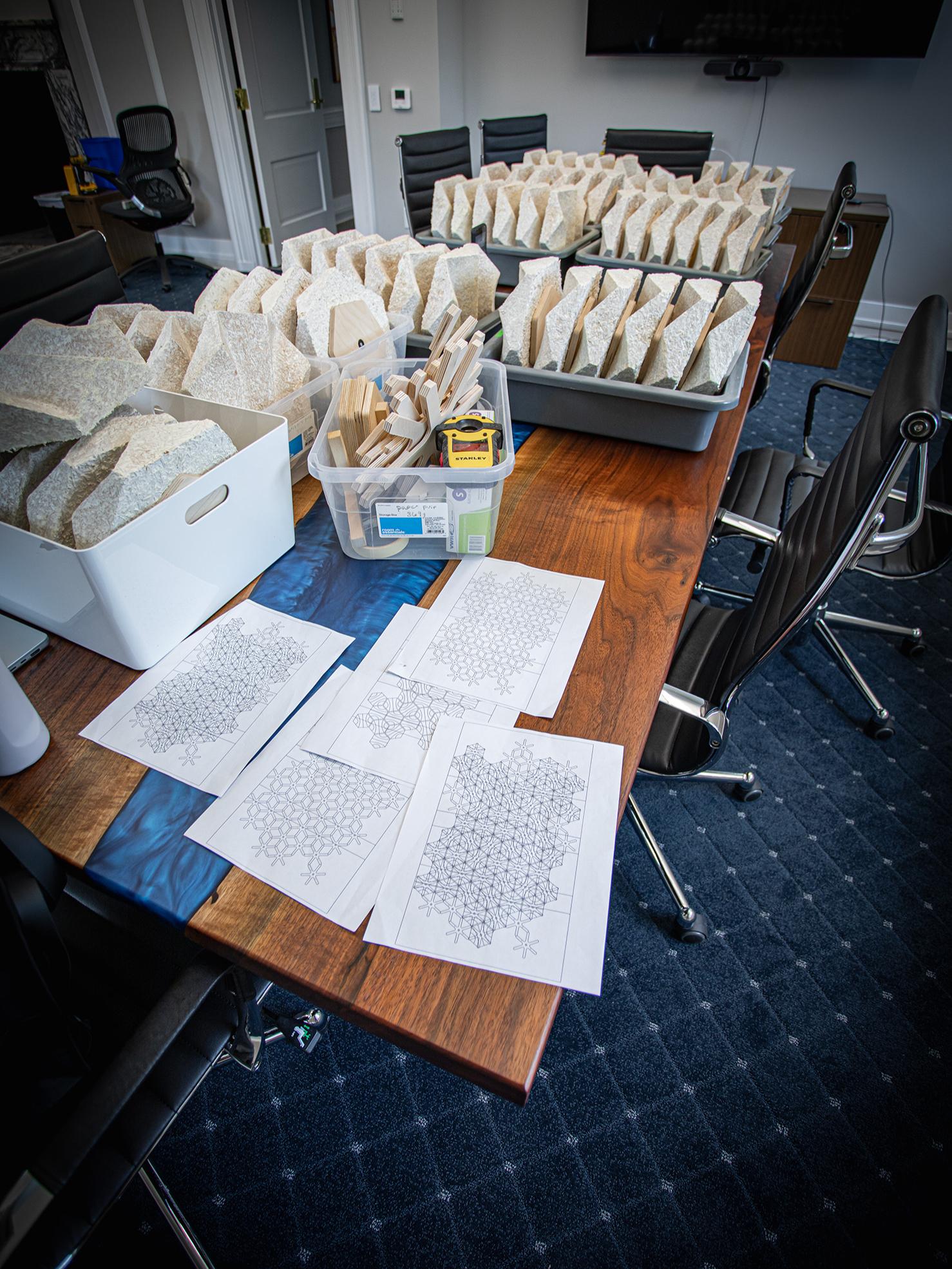 Boxes of components and papers for the installation of an acoustic wall.