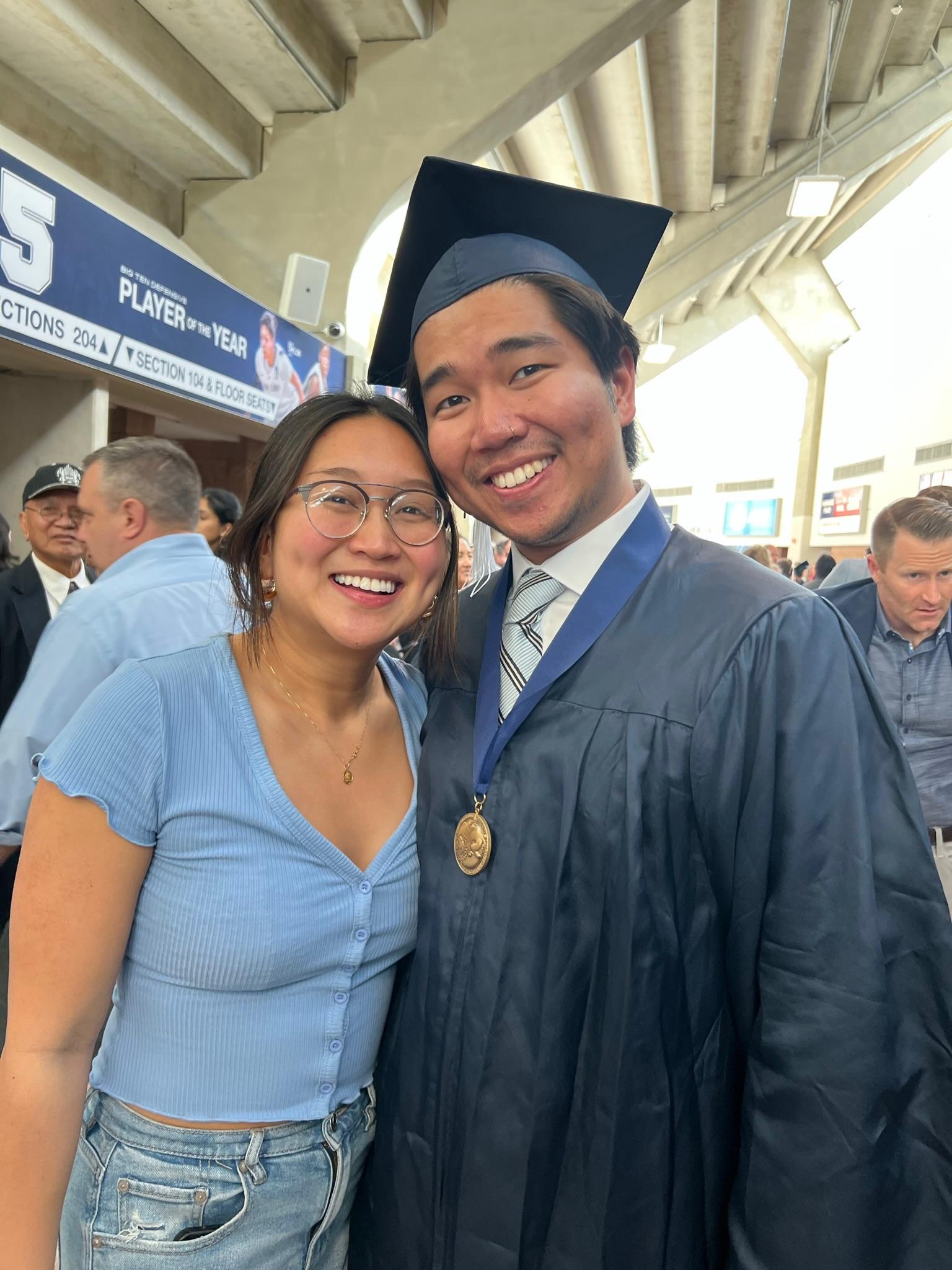 Lindsay and Anton pose at Anton's graduation