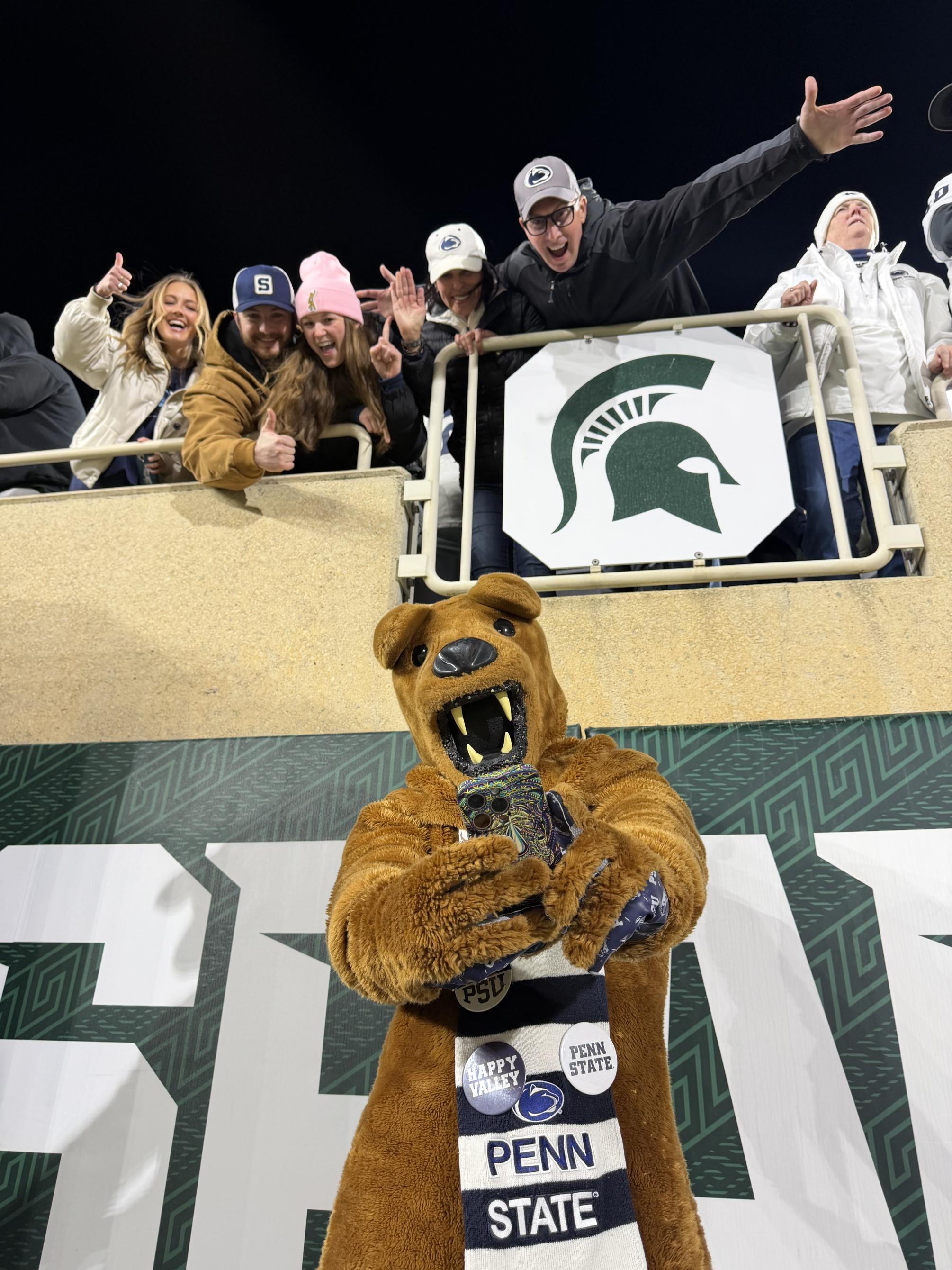 Nittany Lion mascot takes a selfie with fans