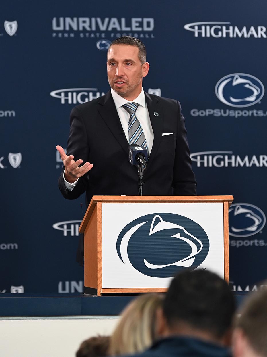 Campbell speaking at podium