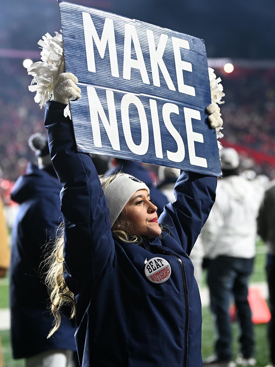 Cheerleader holding sign