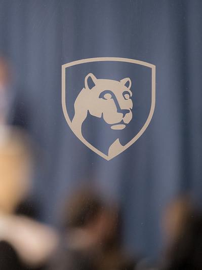 An image of the Penn State shield superimposed on a blurred background