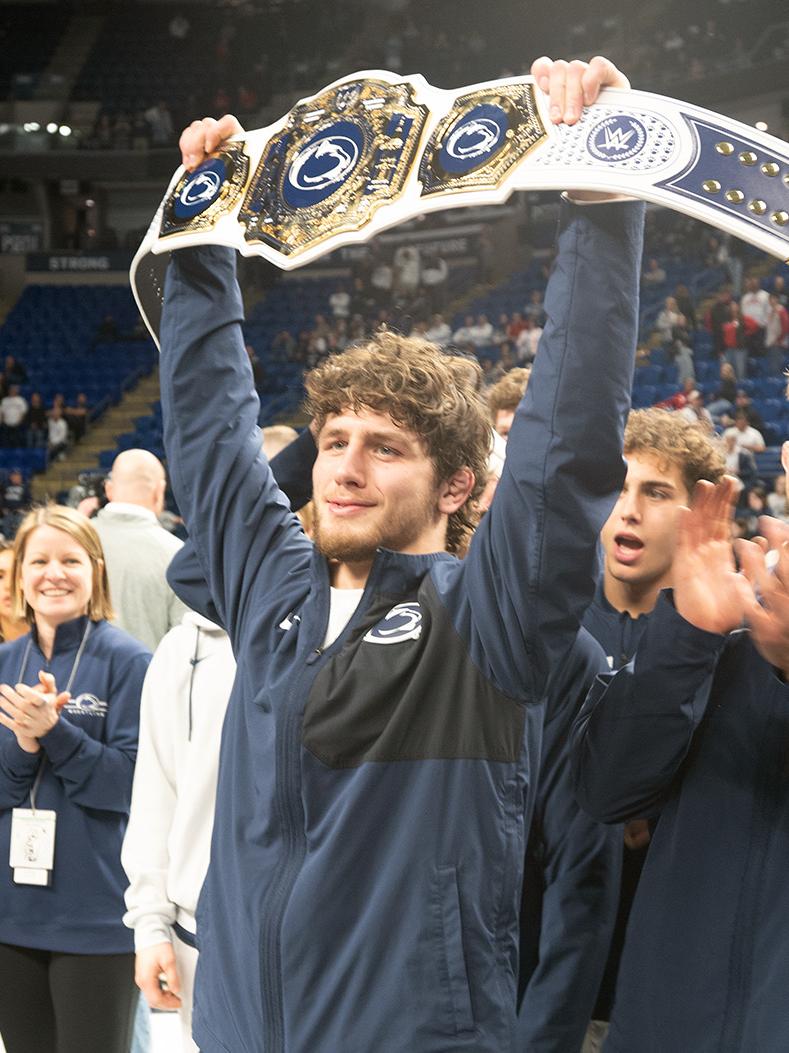 Wrestler hoists belt