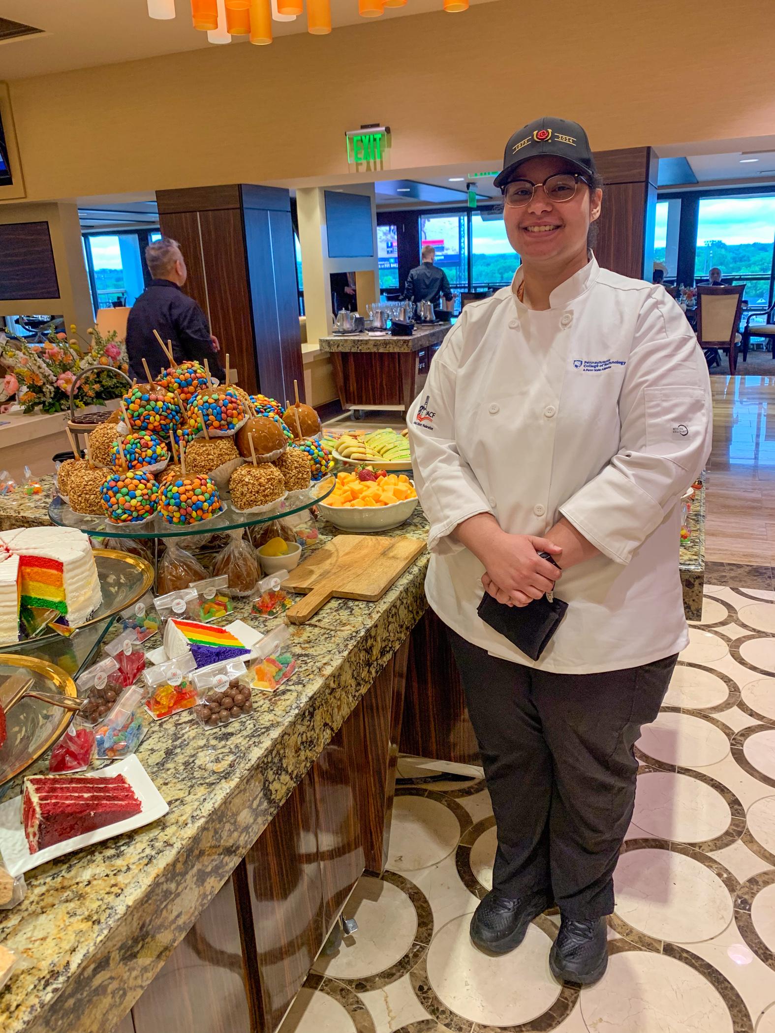 Jeanita J. Pierre and delicious looking desserts on a table