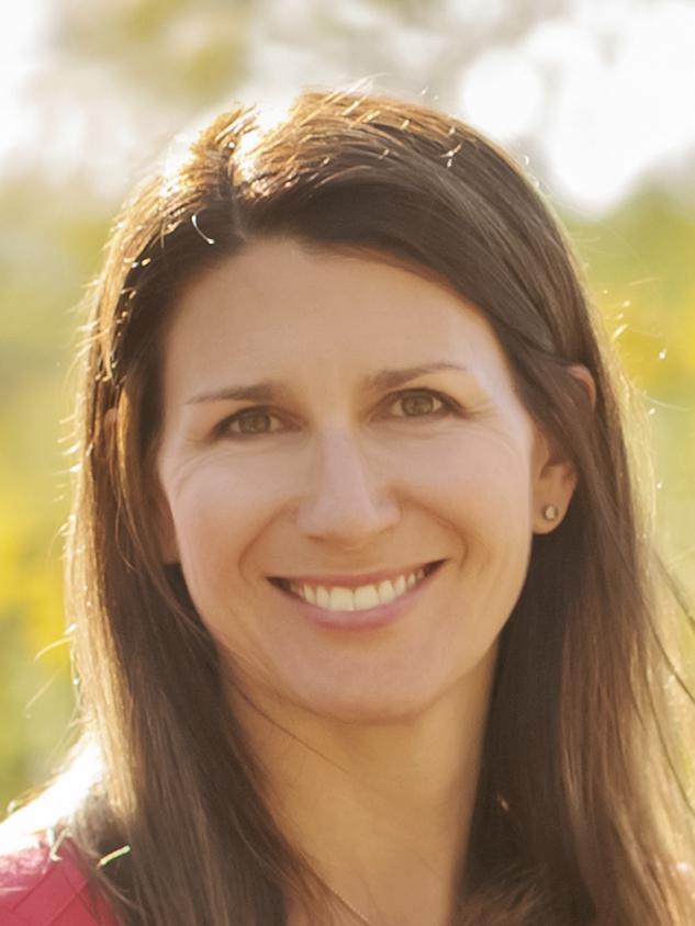 Alicia Drais-Parrillo stands against field backdrop 