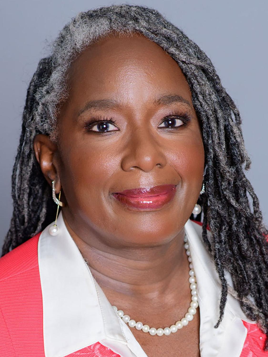 A headshot of Menah Pratt.