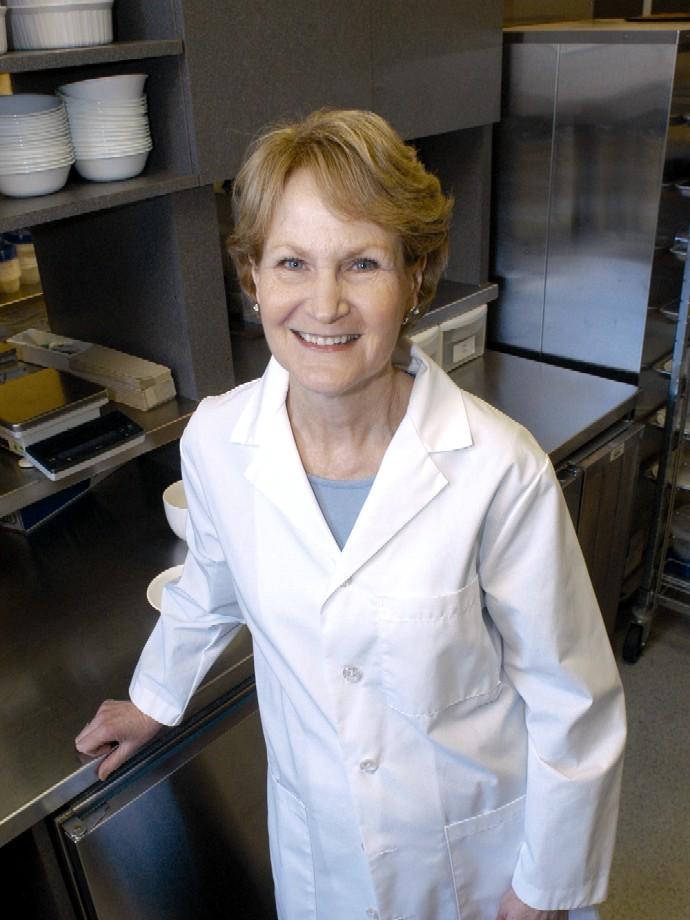 Barbara Rolls is pictured wearing a lab coat in her lab