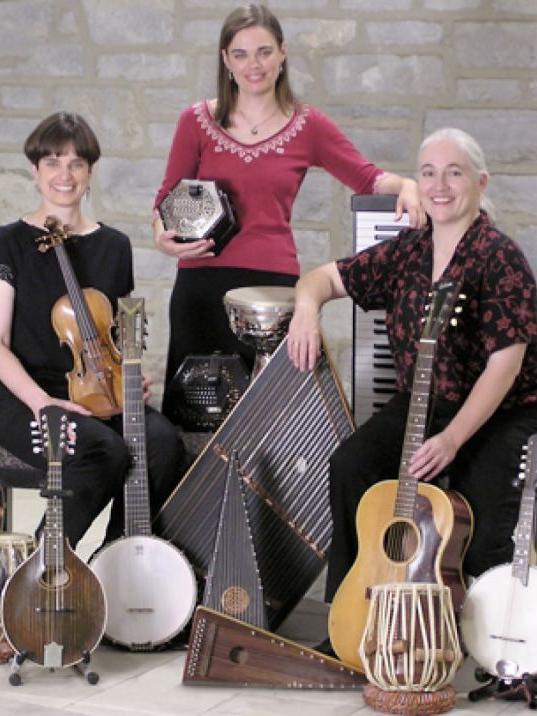 three people with musical instructment