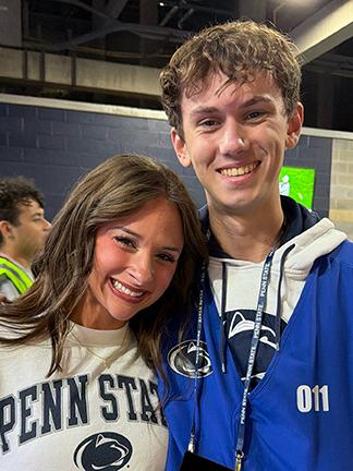 Two smiling students side by side