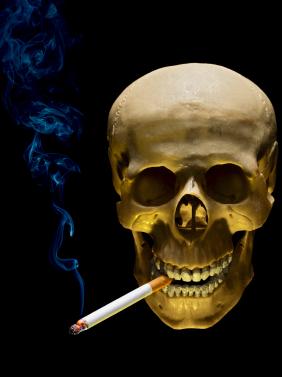 Human skull smoking cigarette on black background