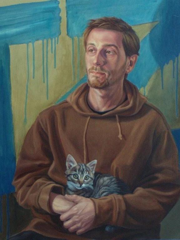 Portrain of a man holding a cat