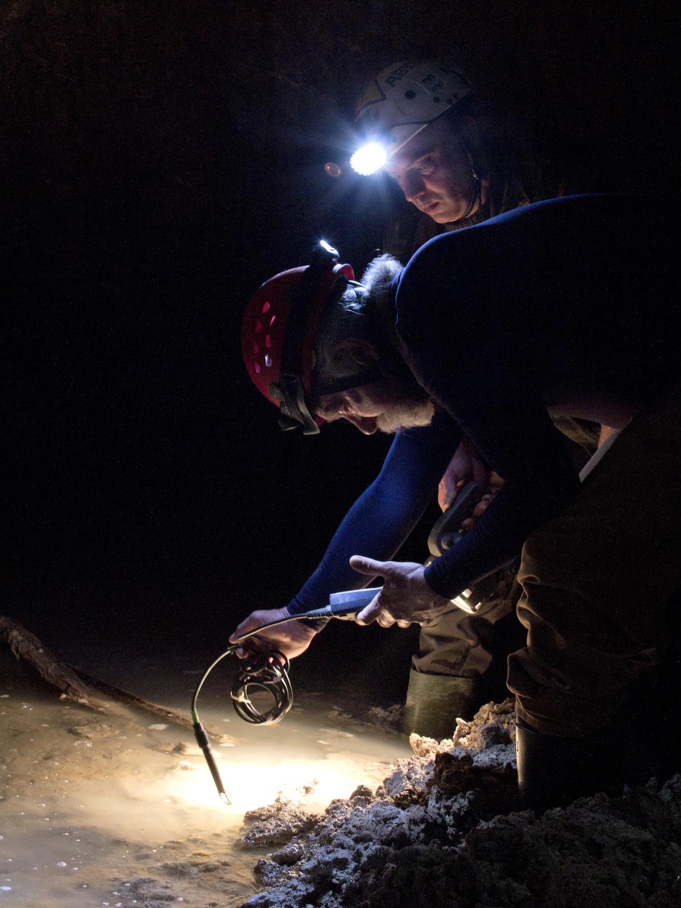 Penn State professor Mike Arthur samples water in Italian cave