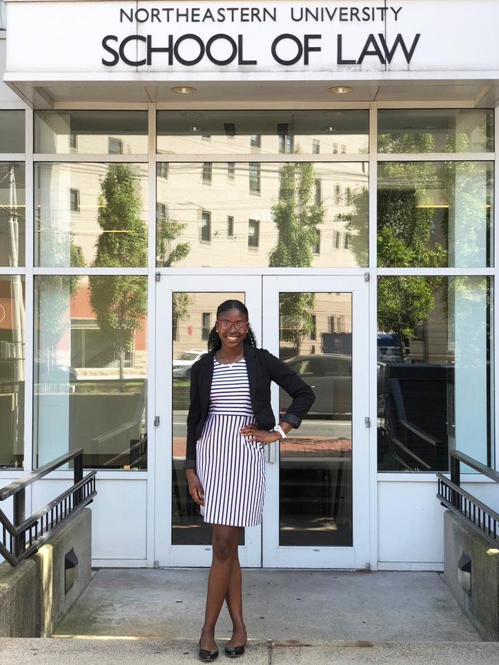 Awaly Diallo standing in front of Northeastern School of Law
