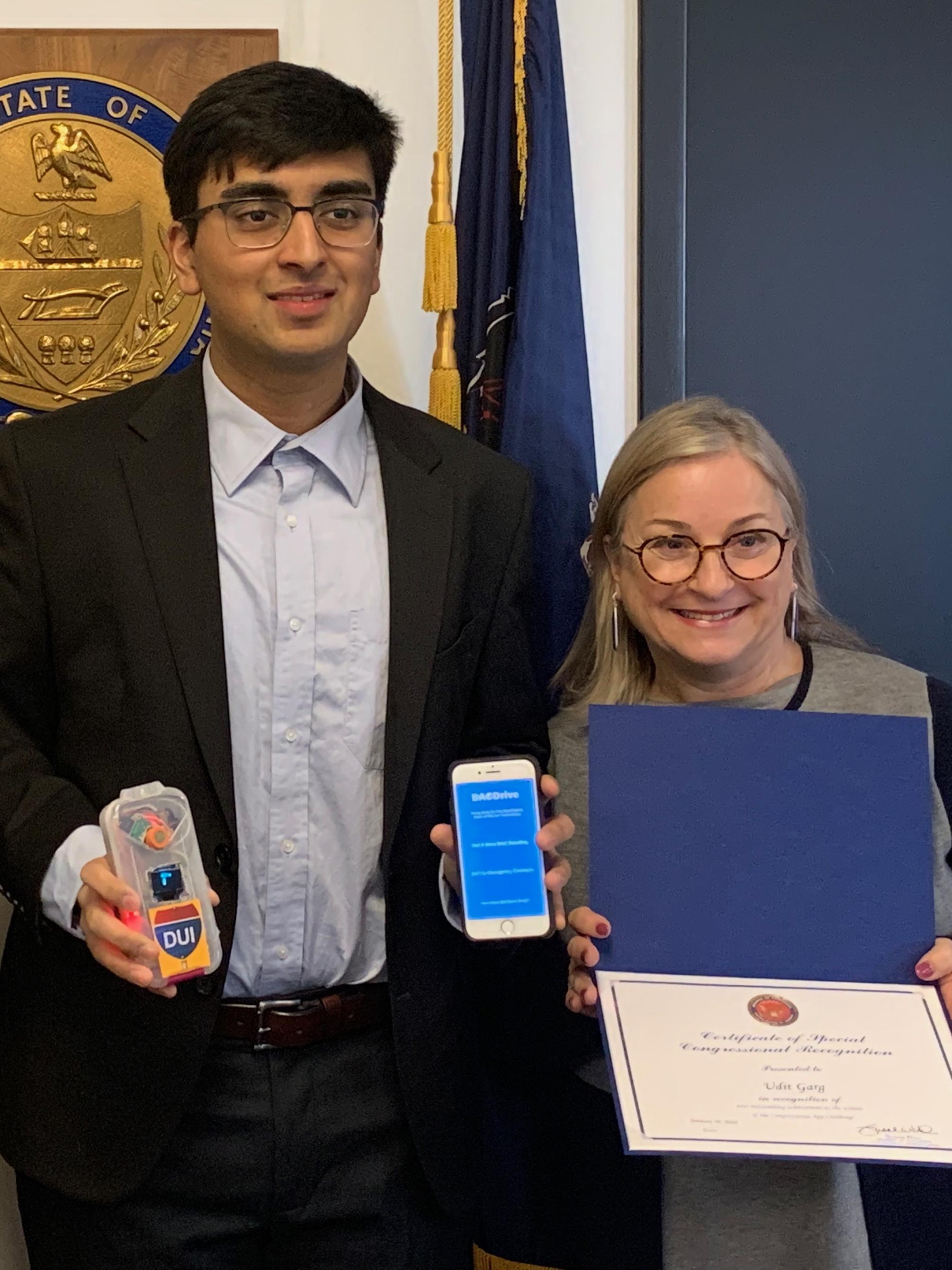 high school male student and short blond woman Congresswoman Susan Wild
