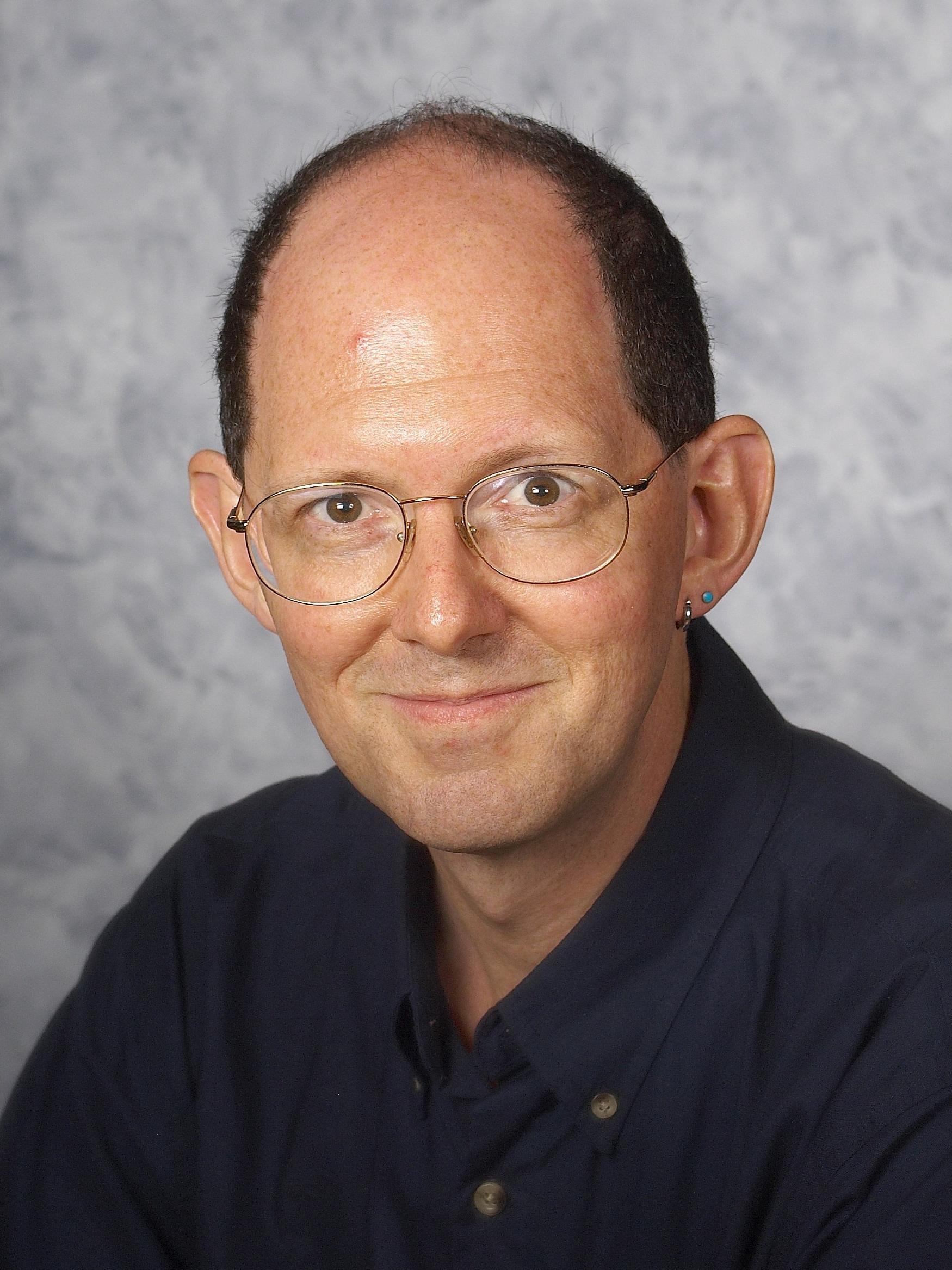 Mark Ballora looks directly at the camera in a professional headshot.