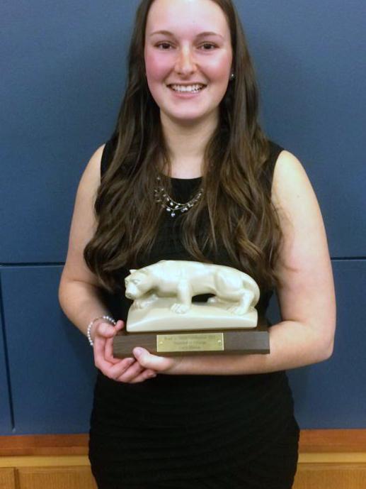 Carly Hinton stands with her THON Award