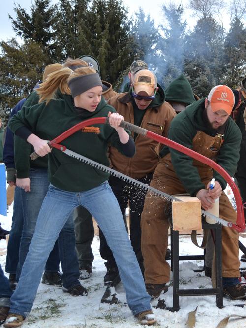 Celine Colbert competes in the bow saw event