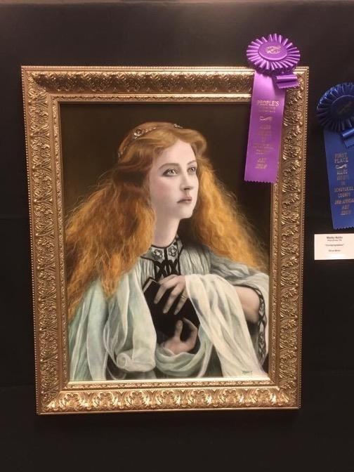 Gold framed oil painting of a young woman with curly red hair draped in robes and carrying a book. Prize ribbon in upper righthand corner.