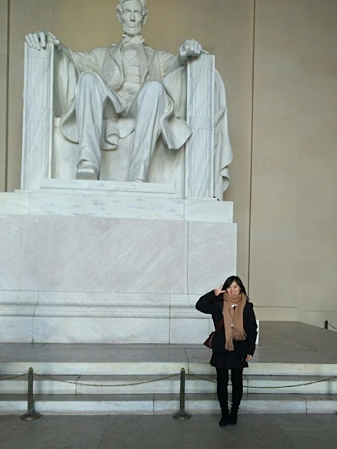 Student posing in front of Lincoln memorial