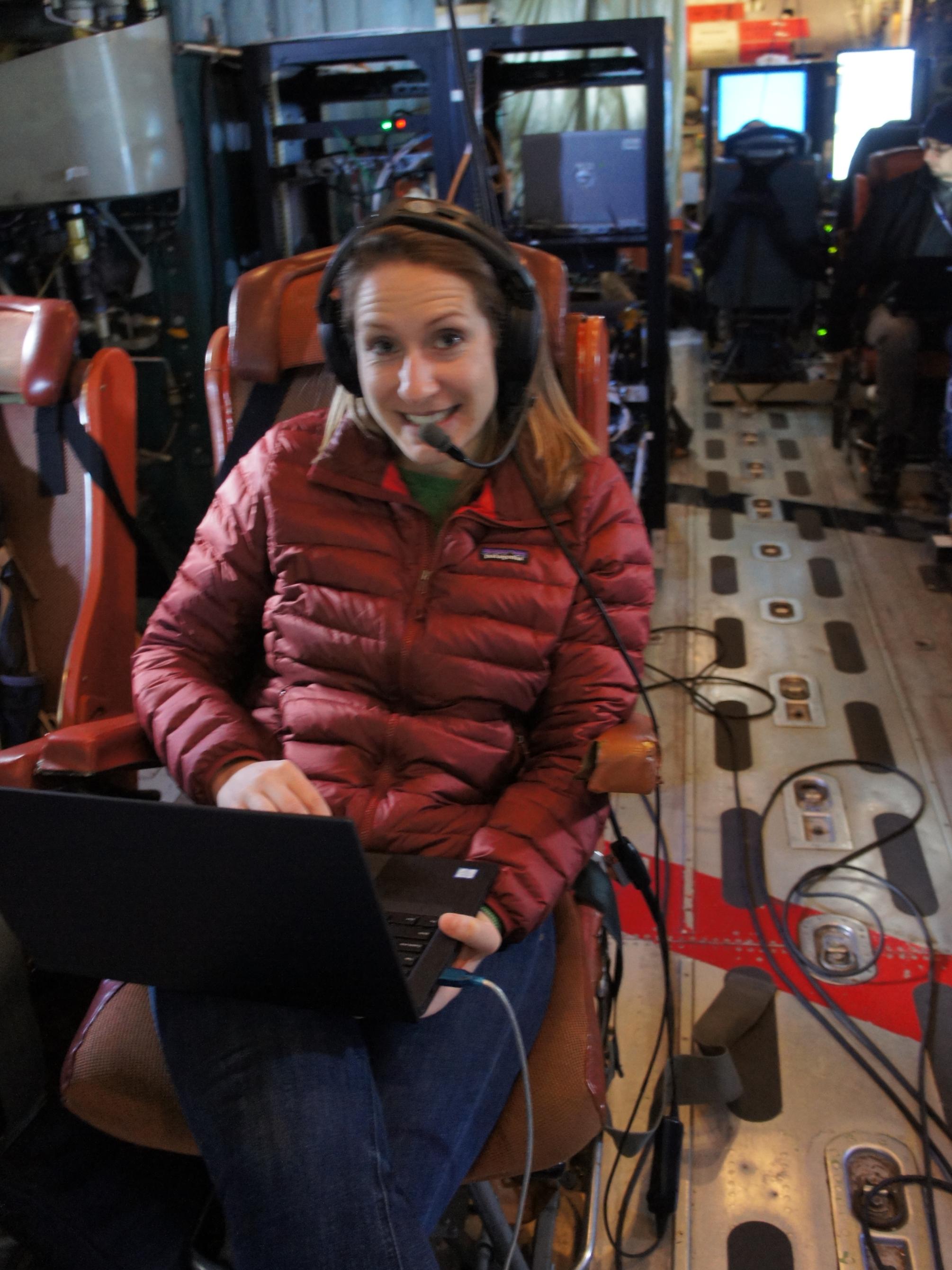 Recent Penn State graduate Bianca Baier sits aboard a C-130 research plane