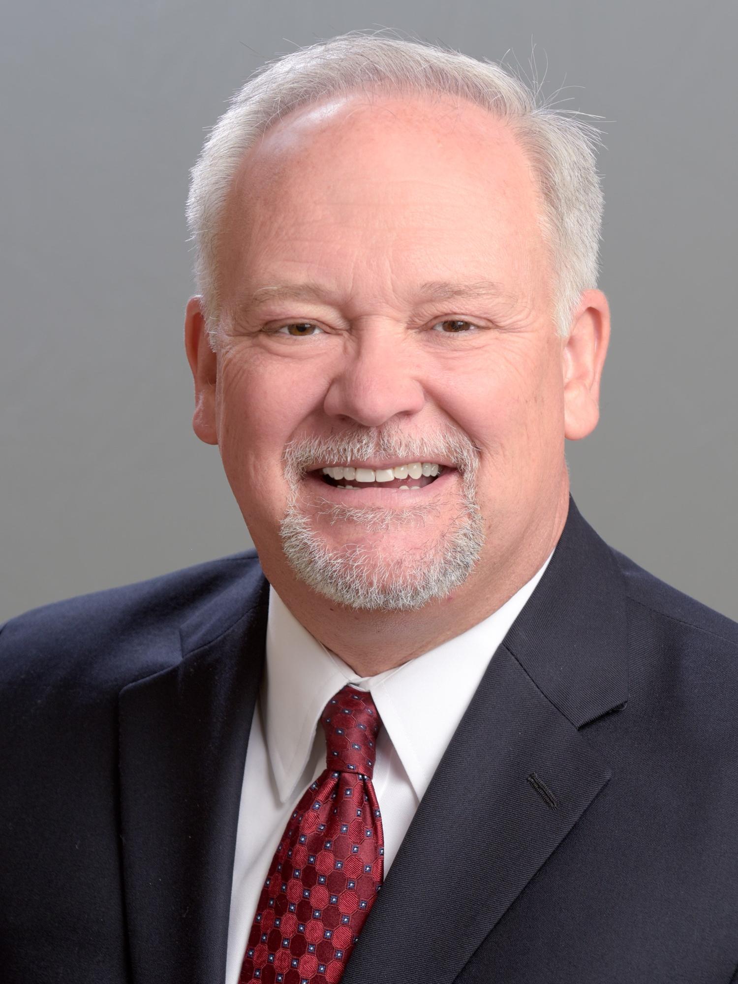 Edward Chabalowski poses for a professional headshot.