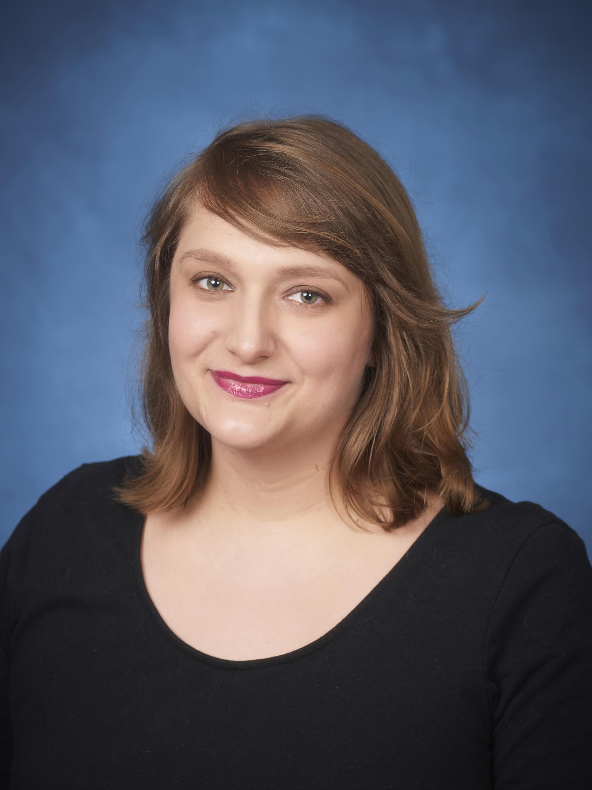 photo portrait of woman in dark blouse