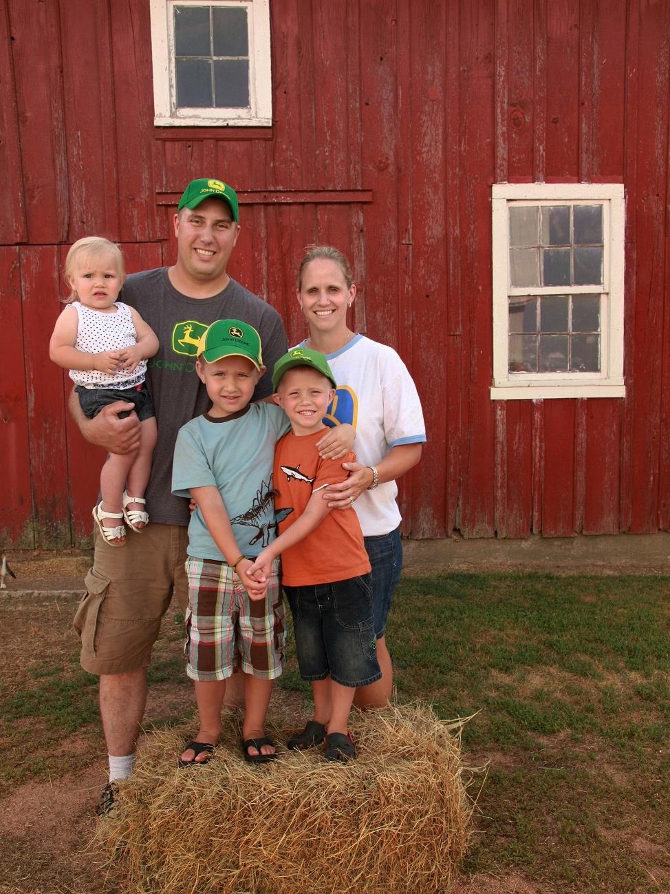 Family on hay bale