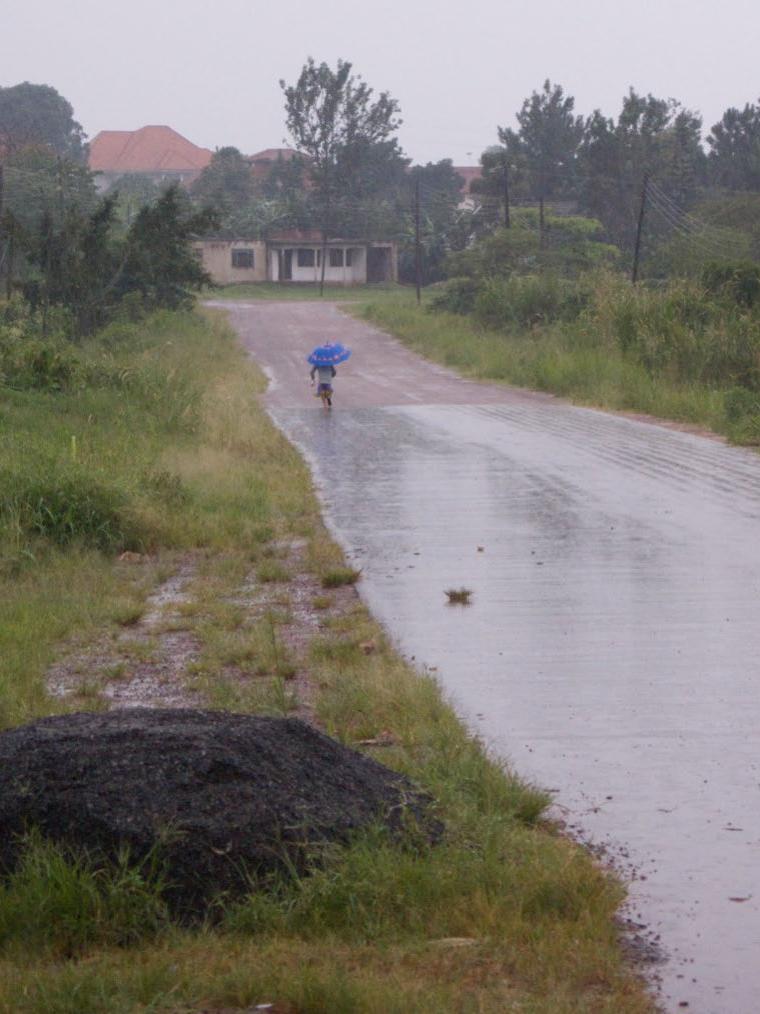 Ugandan girl in rain