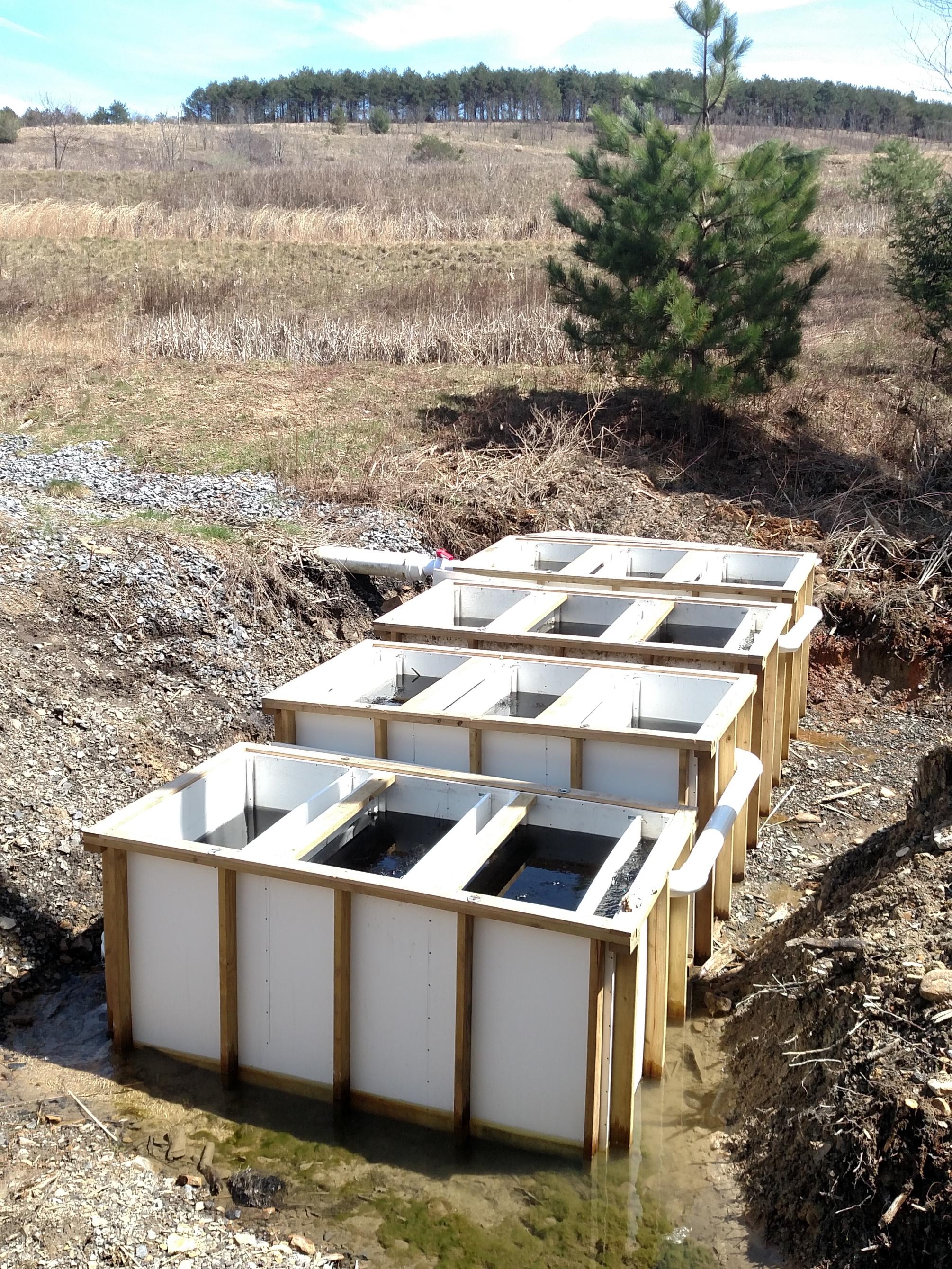 white boxes setup to treat acid mine drainage