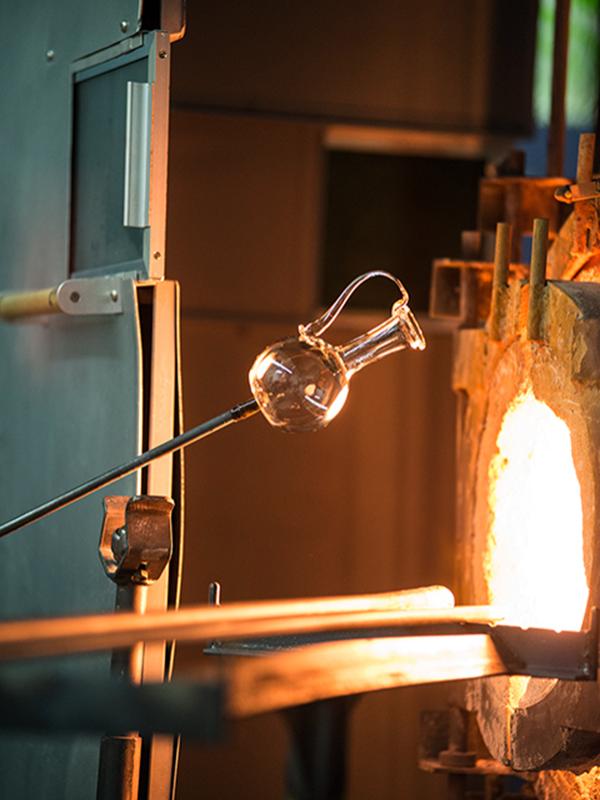 Distinguished Professor of Materials Science and Engineering Carlo Pantano shapes glass at his glass blowing studio in the Hosler Building.