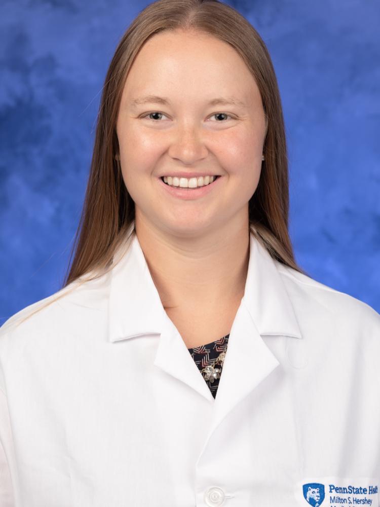 A professional headshot of Dr. Alicia Greene, wearing her physician coat.