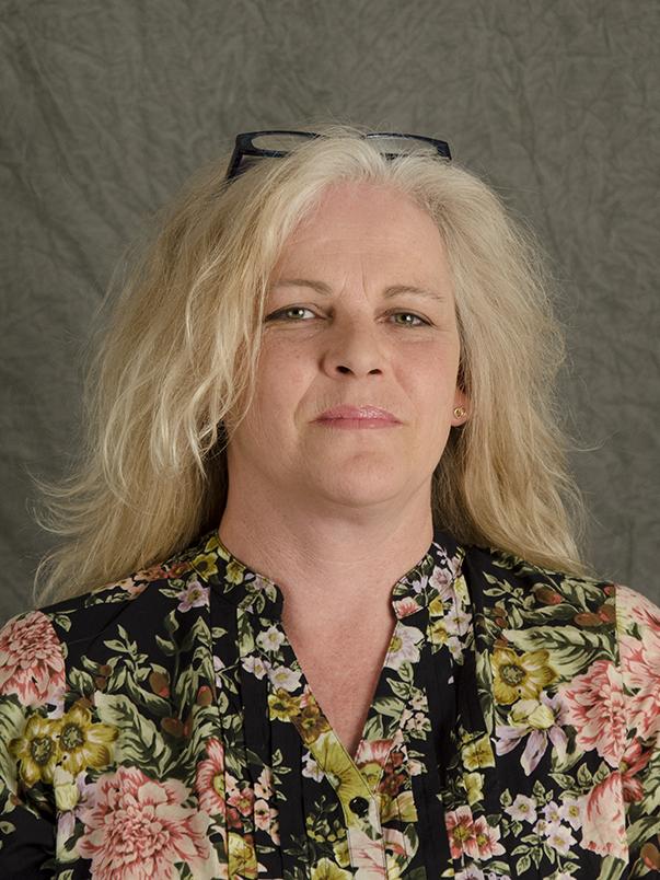 photo portrait of woman in floral patterned blouse