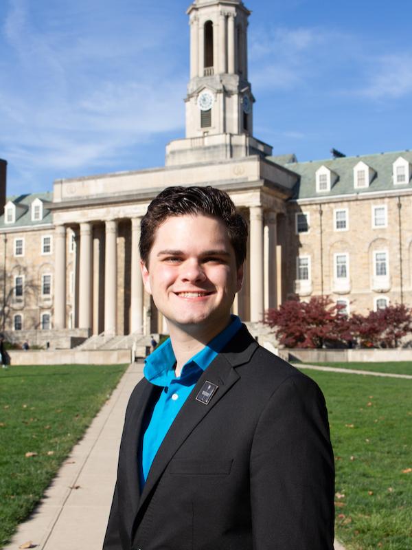 Headshot of Frederick Miller in front of Old Main