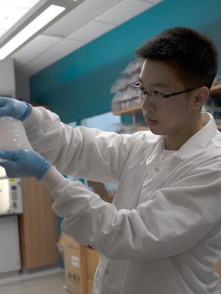 Hetian Hu, a graduate student in in the Department of Agricultural and Biological Engineering, holds bacterial cellulose.