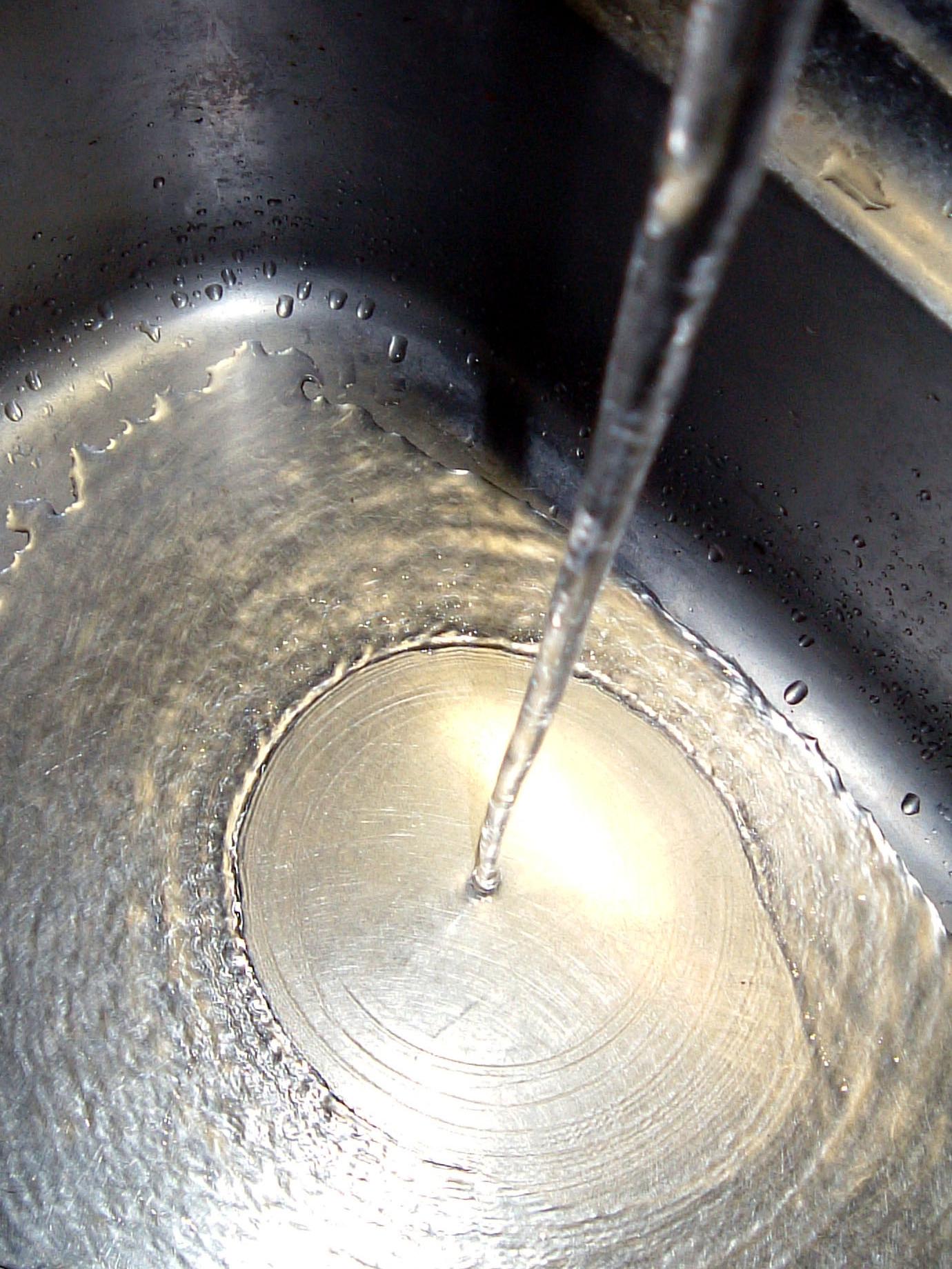water hitting sink basin