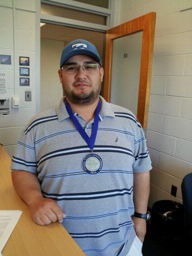 student wearing a medal