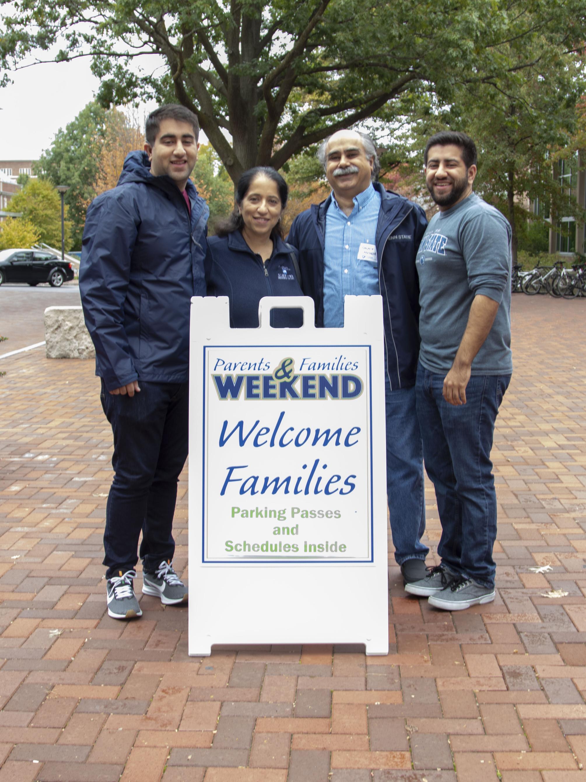 Family posting outside of the HUB during Parents and Families Weekend 2019