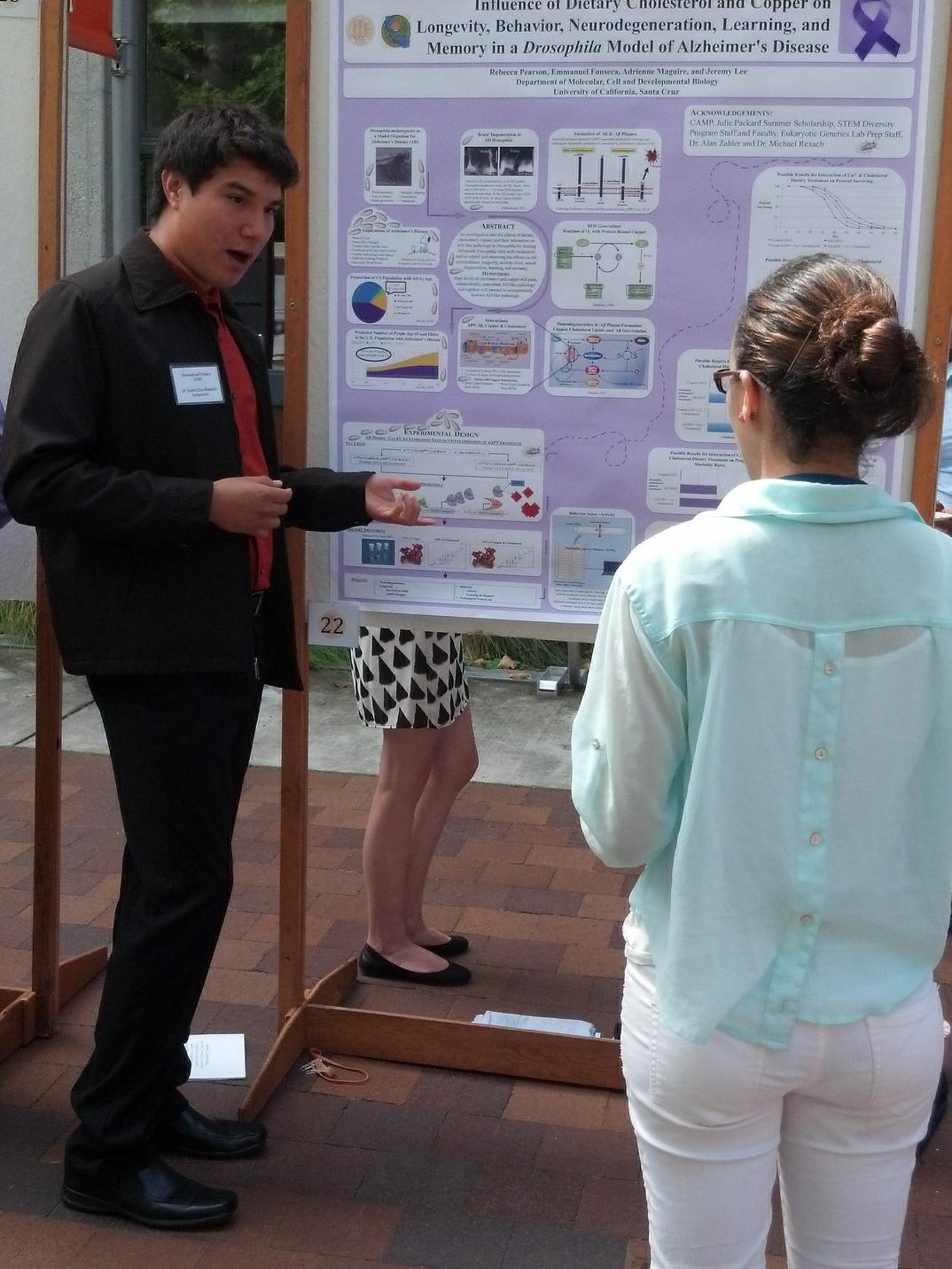 Fonseca standing with a poster