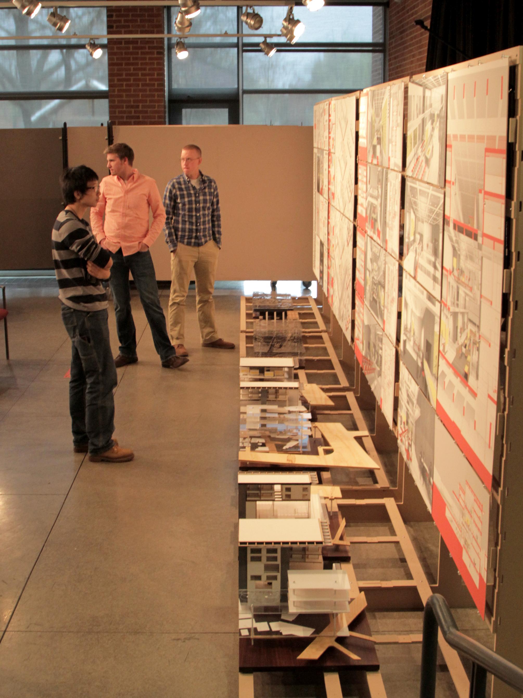 Students looking at Julius' project 