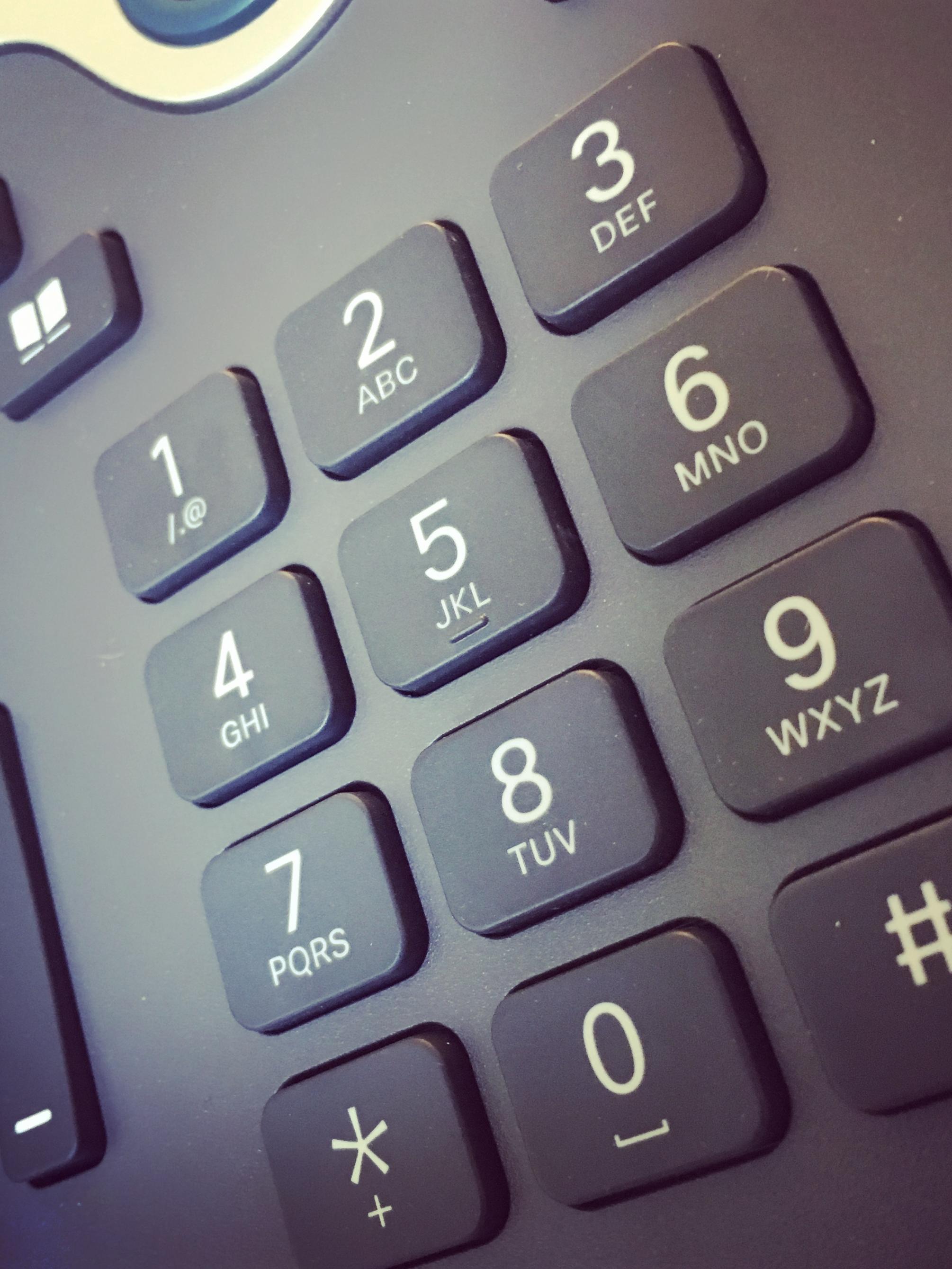 A close-up photo of a telephone's keypad