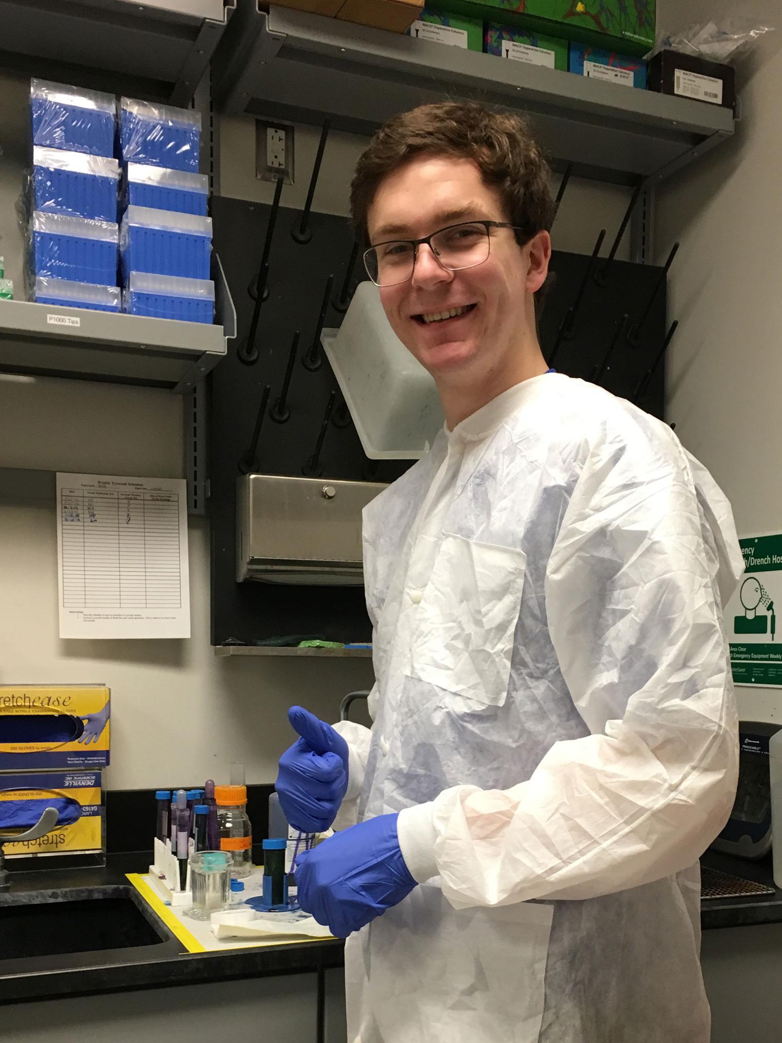 Cuyler Luck with lab coat and glasses