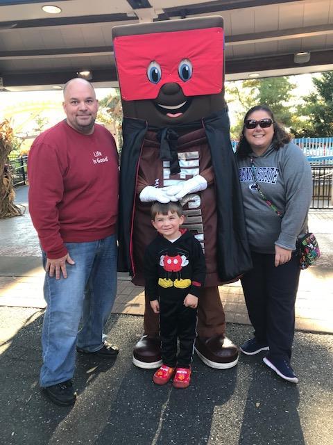 Markey, husband and child with Hershey bar