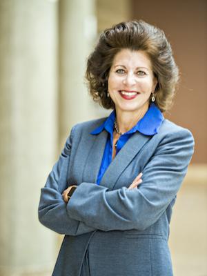 Jacqueline Hinman standing/posing for a photo